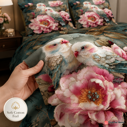 Decorative pillow with embroidered birds and flowers held by a hand, with 'Soft Cotton Feel' logo.